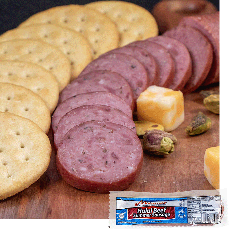 Halal beef summer sausage in slices fanned out in a curve, butter crackers are fanned out to the left of them, a cube of colby jack cheese is to the right and some pistachios are scattered around. A pack of Midamar Halal Beef Summer Sausage is overlaid in the bottom right corner.