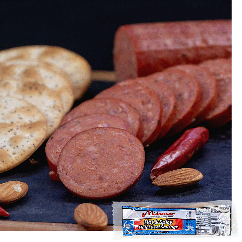 Slices of halal hot and spicy beef sausage is cut up and fanned out in a curve to the right. Large crackers are lined up to the left. A red dried pepper is to the right and some almonds are scattered around. A package of Midamar Hot and Spicy Halal beef Sausage is overlaid in the bottom right corner.