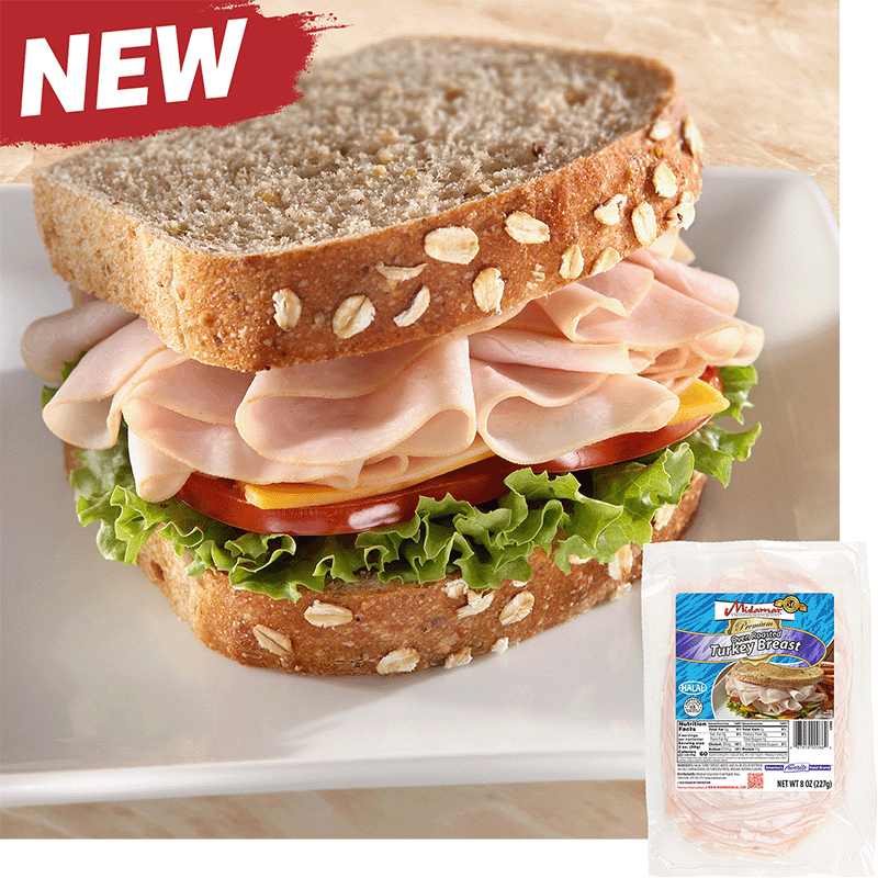 A turkey sandwich with oats baked into the top of the bread. The sandwich is piled high with Midamar halal turkey which is resting on a slice of cheese, tomatoes, and lettuce. In the bottom corner is an image of the product package